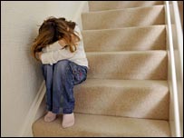 Young girl sitting on stairs