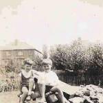 Terry and I (in white shirt) sitting on our shelter.