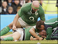 Ronan O'Gara of Ireland receives medical treatment after receiving a heavy blow on the final whistle