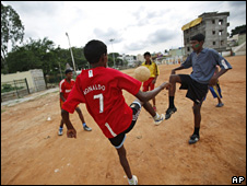 Boys playing football in India