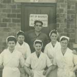 Alice Wade (centre) with fellow workers and butcher in Twy-croes Wales in 1942