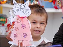 Little boy at the art stand