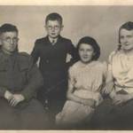 A photo of me with my mum, dad and older sister taken about 1943-44