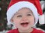Little girl wearing a Santa hat