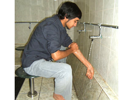 Washing the left arm.