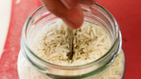Knifeblade sunk into jar of rice