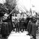 Bert and Gladys Osborne on their Wedding Day outside Osmington Church with a Home Guard of Honour. 22nd December 1940.