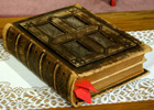Old leather-bound Bible with ribbons marking pages