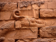 Detail of a carving showing the head of the Babylonian god Marduk