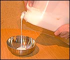 Picture: Pouring the borax into a metal bowl