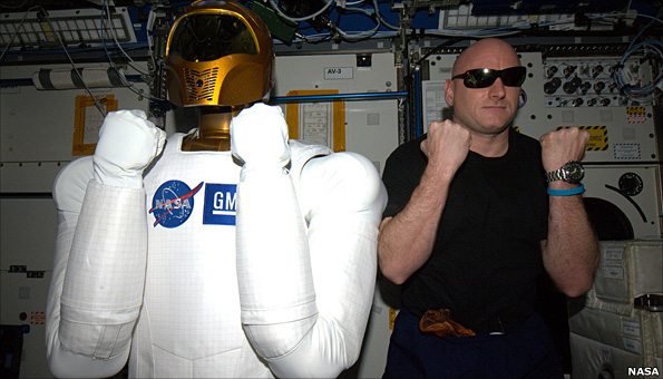 Robonaut and astronaut on station