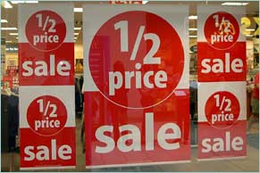 Half-price sale sign in a shop window