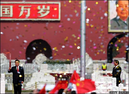 China's President Hu Jintao with the Olympic torch in Tiananmen Square