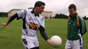 Conall Ó Máirtín demos the hand pass to young player at Stormont Assembly.