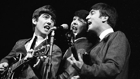 George Harrison, Paul McCartney and John Lennon performing in 1963