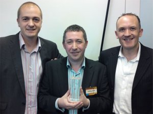Gareth Ford Williams, Jonathan Hassell and James Hewines picking up the award