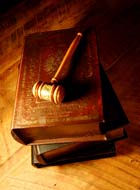 Judge's gavel and a stack of legal books. © Stefan Klein/iStockphoto