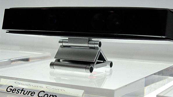 Long horizontal black sensor strip, in a black frame, on a perspex stand.