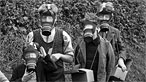 Evacuees with gas masks