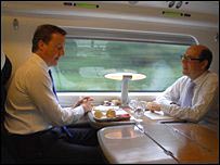 David Cameron and Nick Robinson on a train