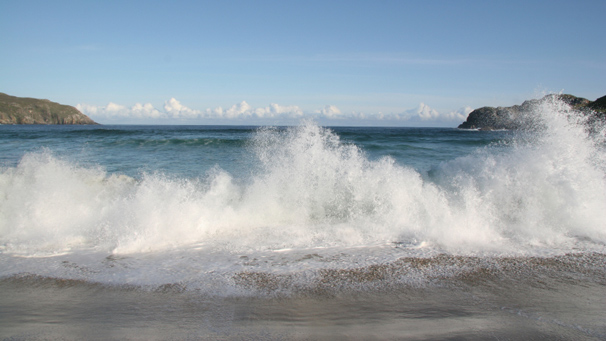 wave breaking on beach