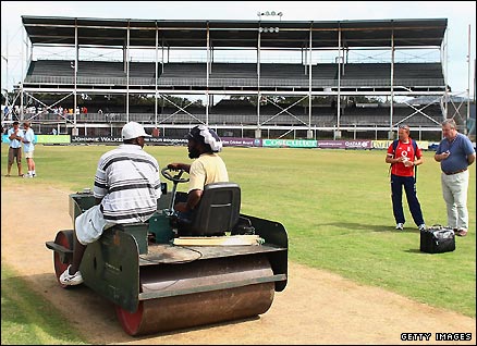 Groundsmen work to get the ARG pitch ready for the third Test