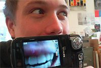 smiling face on video camera