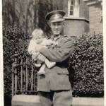 LESLIE HOLDING HIS NEPHEW HARTLEY BROWN OUTSIDE HIS GRANDMA BROWN'S, OAKFIELD HOUSE, FIFE ROAD, NORTON ON TEES, AROUND 1935