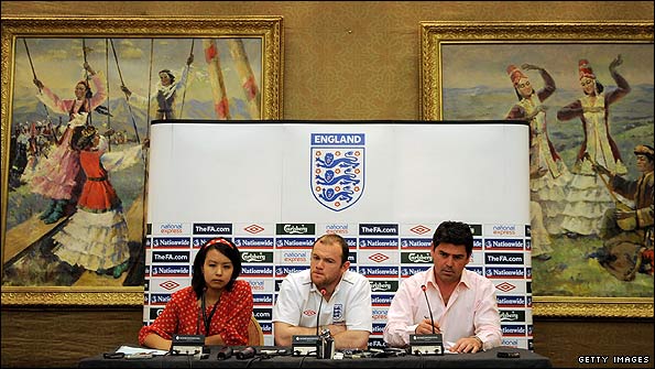 Wayne Rooney at a press conference in artistic surroundings