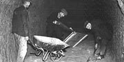Workmen clearing out the caves for use as an air raid shelter.
