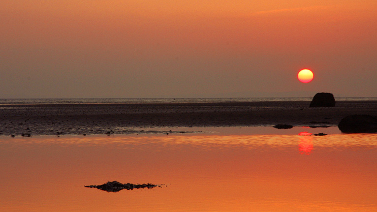 Sunset over West Shore Beach by Jonathan Demery