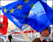 Kosovo Albanian boy with EU flag on a bridge near town of Kacanik