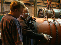 Checking the plates on the boiler