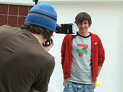 A prospective male model has his photo taken
