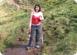 Julie McElroy using walking poles on 'The Whangie'