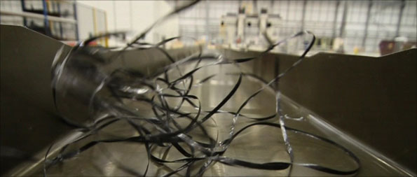 A carbon fibre wing spar, and the tape it is made from