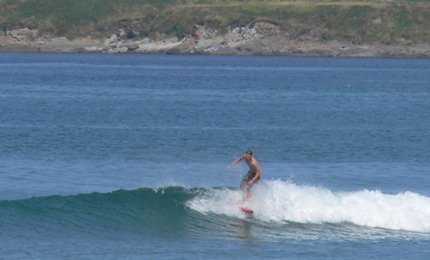 A brave contender. More summer boardshort action from sunny Brandon Bay. Water 16 Celsius. Pic: Ger. July 06