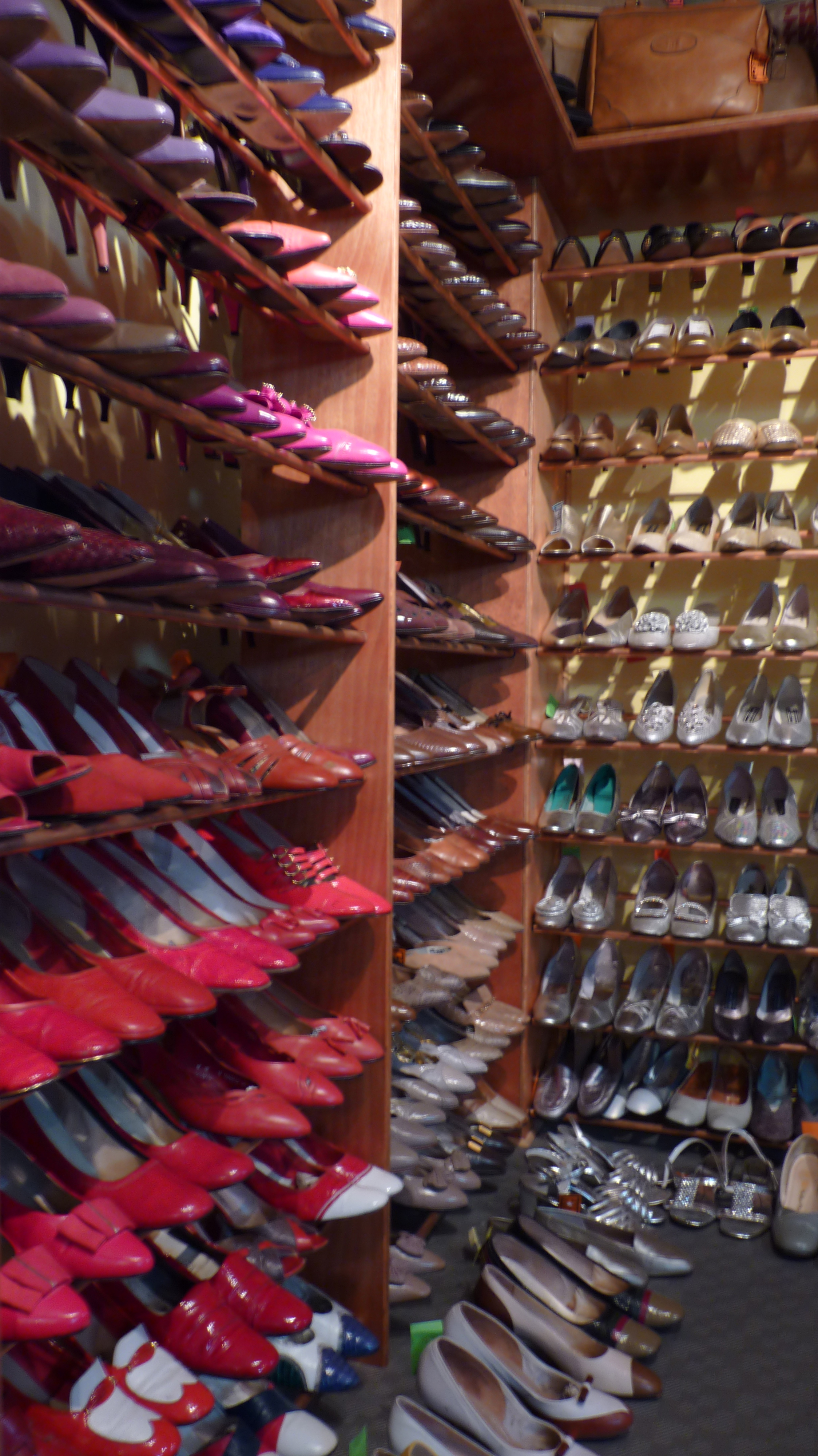 Shelves of colourful shoes in a shoe shop