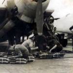 HMS Implacable, aircraft carrier (possibly 1945). Crew loading an Avenger plane with smoke bombs for practice attacks on the fleet.