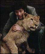 Louis Foley with a lion
