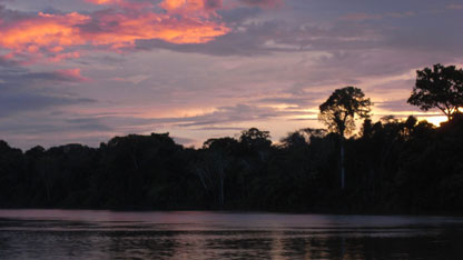 The sun sets over the river