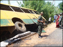 A soldier inspecting the wrekage of the bus (library photo -June 2006)