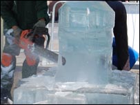 Dave Gross sculpting ice with a chairsaw