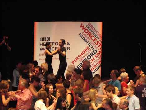 Flavia and Vincent begin their masterclass at The Forum Theatre in Malvern - part of BBC H&W's Summer of Salsa.