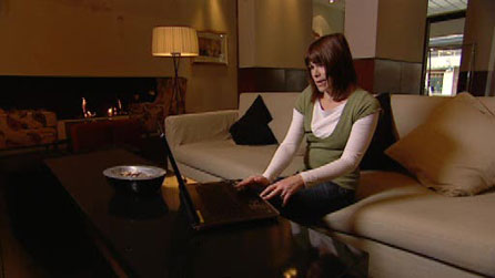 Rachel Treadaway-Williams using a laptop in a hotel