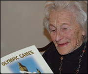 Mullie today: reading about the Olympics 