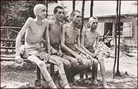 A photograph showing a group of starved victims at Ebensee concentration camp