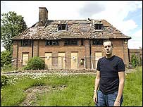 Ian Silverstein outside his ruined house