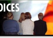 Image of Catholic women from Ardoyne, backdrop Irish flag 