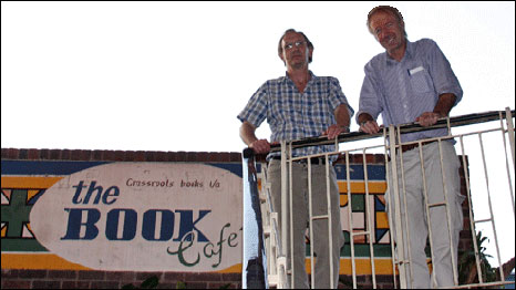 Paul Brickhill (left) and Mike Thompson (right) outside the Book Cafe in Zimbabwe, Harare